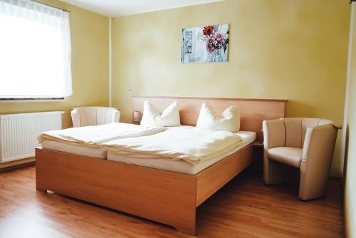 Postel nebo postele na pokoji v ubytování Ferienzimmer direkt am See