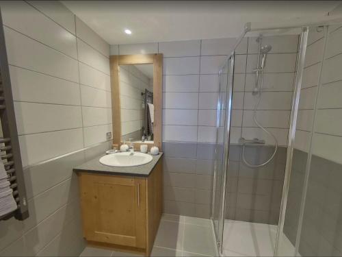 a bathroom with a sink and a shower at Bisanne 1500 - Appt 6 pers, 2 SDB, Parking, Piscine - FR-1-293-354 in Villard-sur-Doron