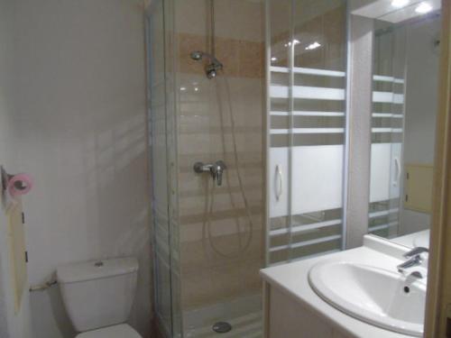 a bathroom with a shower and a toilet and a sink at Appartement Valfréjus, 3 pièces, 8 personnes - FR-1-561-95 in Modane