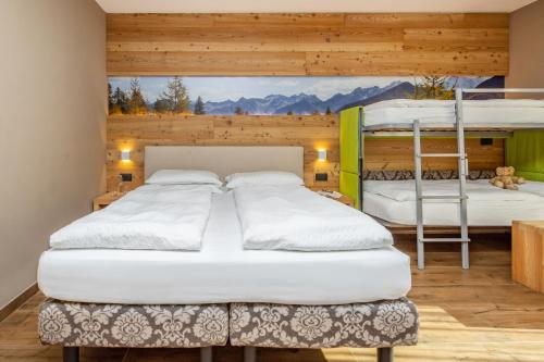 Una cama o camas en una habitación de Hotel Vittoria - Ricarica l'anima