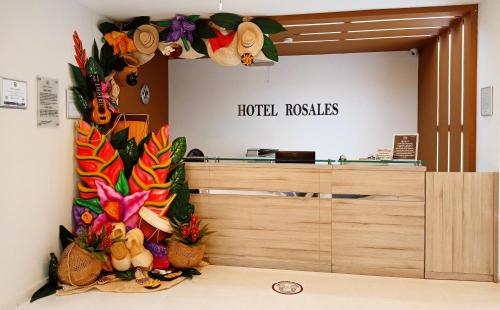 a hotel lobby with a display of fruits and vegetables at Hotel Rosales Boutique in Neiva