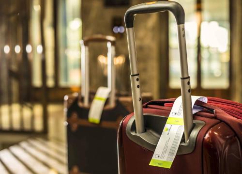a group of suitcases sitting on a train at The Monarch Hotel & Convention Centre in Trivandrum
