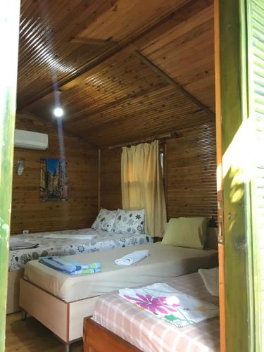 A bed or beds in a room at Olympos Zeytin