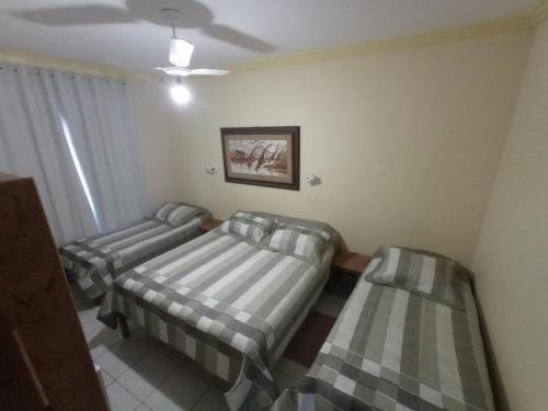 Una cama o camas en una habitación de Aconchego Canastra Hotel