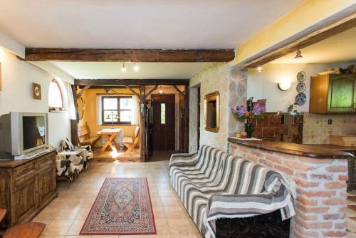 a living room with a couch and a fireplace at Amigówka in Wieliczka