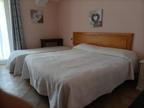 Postel nebo postele na pokoji v ubytování B&B Agriturismo Regno di Toscana
