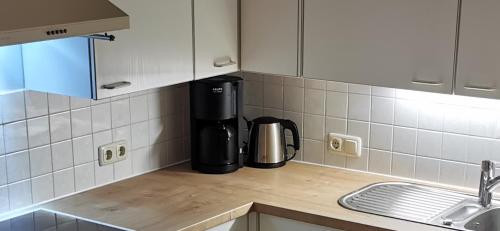 a kitchen with a coffee maker on a counter at Am Kaltenbach - Spital am Semmering, Stuhleck in Spital am Semmering