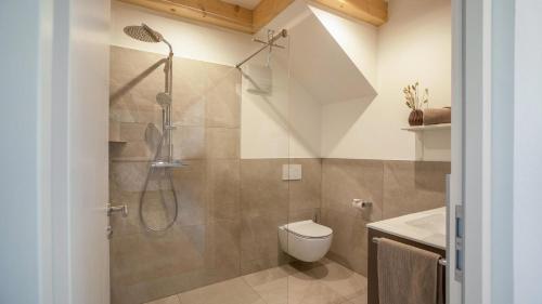 a bathroom with a shower and a toilet and a sink at Meine Bleibe Apartment Olive in Appiano sulla Strada del Vino