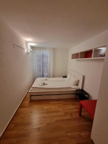 a small bedroom with a bed and a window at Modern and bright apartment opposite ski-lift in Münster