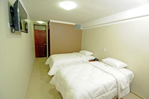 Postel nebo postele na pokoji v ubytování Hotel Plaza Sullana