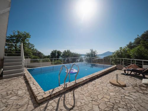 a swimming pool in the middle of a house at Seaview Couple Studio with pool-Przno in Pržno