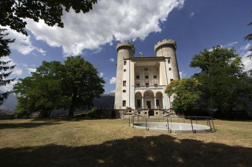 a large white building with trees in front of it at Dialley prato Cir0014 in Aymavilles