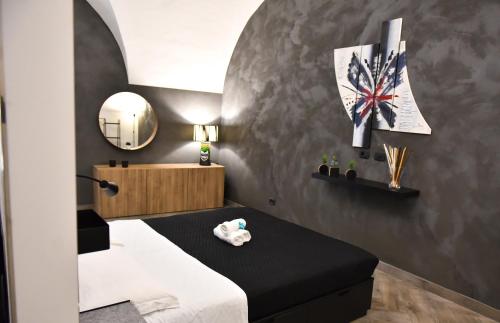Posteľ alebo postele v izbe v ubytovaní Apartments Casa Vacanze Dante