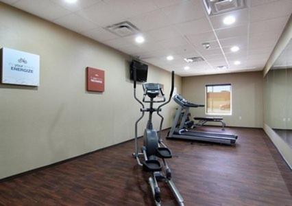 a fitness room with a treadmill and a gym at Comfort Inn Midland South I-20 in Midland