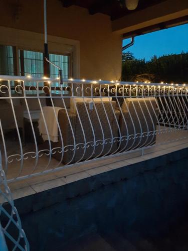 a railing with lights on top of a house at Villa Csilla elegant house in Érd