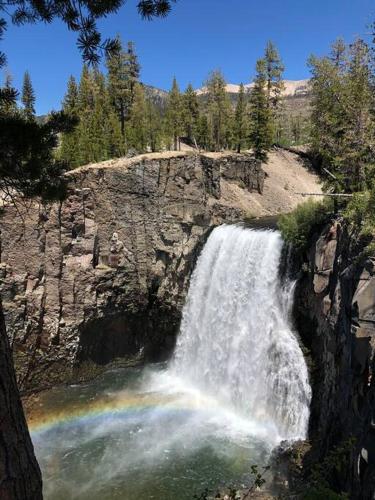 a waterfall on the side of a rocky mountain at Mammoth Awesome Location-1 min to Shuttles & Food! TOML-CPAN-11402 in Mammoth Lakes