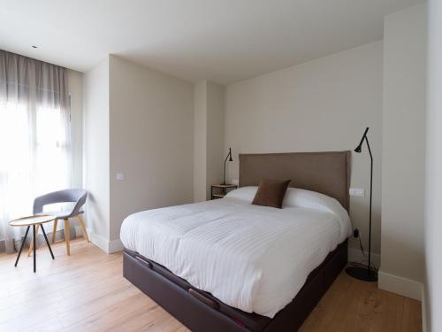 A bed or beds in a room at Luxury Bakus Canteras Beach
