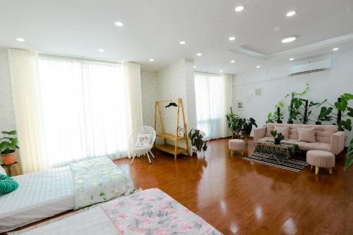 a large living room with a couch and a table at LáVuTa Home in Vung Tau