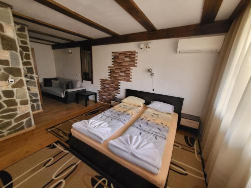 Кровать или кровати в номере Oasis Guest House