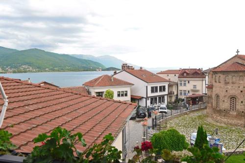 a view of a town with a lake and buildings at Jovanovic Guest House in Ohrid