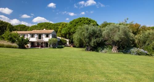 a house in a field with a large yard at Vyylla Private Resort in Saint-Tropez