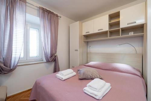 Postel nebo postele na pokoji v ubytování Apartman Stela