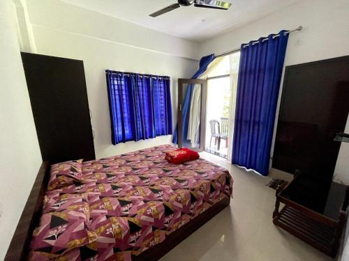 Cama o camas de una habitación en Dakshinakasi Guest House