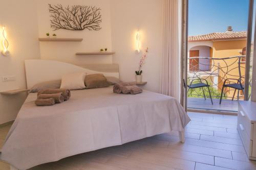 a bedroom with a bed with two pillows on it at Seaside Home in Posada