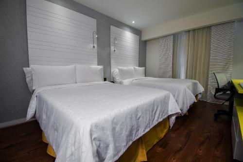 Posteľ alebo postele v izbe v ubytovaní BelAir Business Mexico City WTC, Trademark by Wyndham