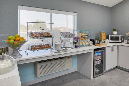 a kitchen with a counter with food on it at Hotel Wave at Rehoboth Beach in Rehoboth Beach