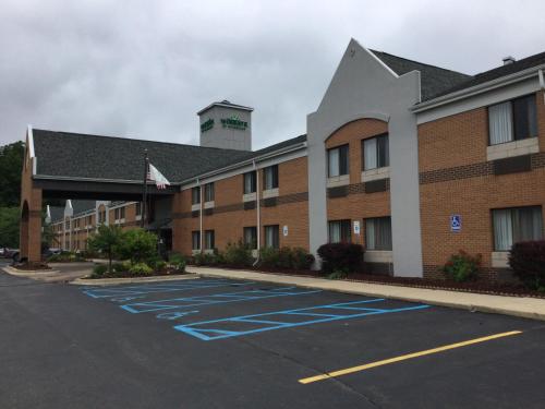 an empty parking lot in front of a hotel at Wingate by Wyndham Brighton in Brighton