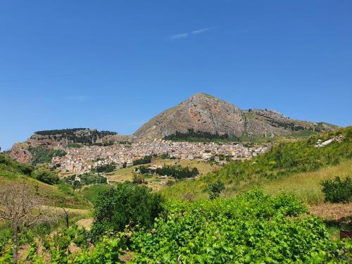 a view of a mountain with a town on a hill at VeraLuce in Caltavuturo
