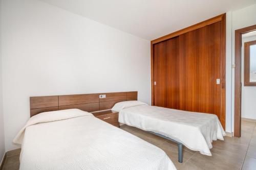 Katil atau katil-katil dalam bilik di Apartaments Vaixell