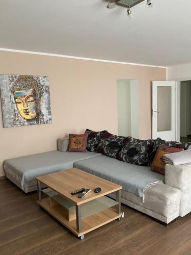 a living room with a couch and a coffee table at Julias Ferienwohnung in Wetzlar