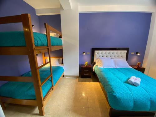 a bedroom with a bunk bed and a ladder at BROTHERs HOUSE in Cusco
