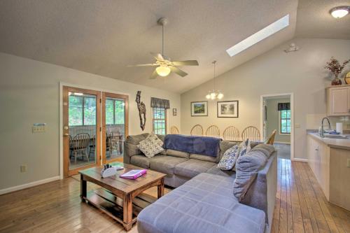 a living room with a couch and a table at 17-Seat Theater, Hot Tub and Game Room Ideal Home! in Massanutten