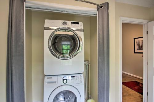 a washer and dryer in a laundry room at 17-Seat Theater, Hot Tub and Game Room Ideal Home! in Massanutten