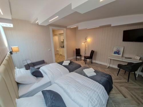 Ένα ή περισσότερα κρεβάτια σε δωμάτιο στο Apartamenty Hayduk