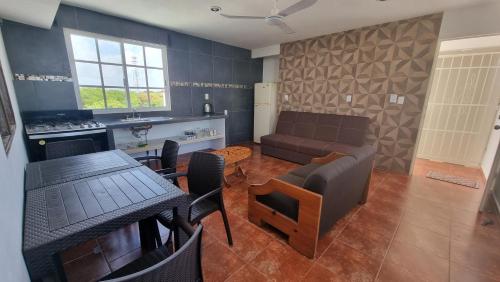 a living room with a couch and a table at A una calle del ado 5ta avenida in Playa del Carmen