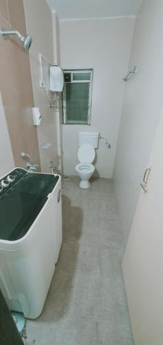 a bathroom with a sink and a toilet in it at Alibaug Castle Villa in Nagaon