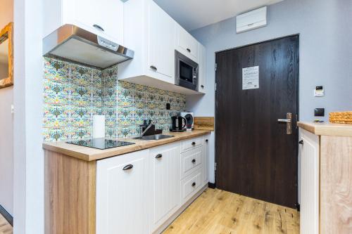 Η κουζίνα ή μικρή κουζίνα στο Pałac Tatrzański Apartamenty