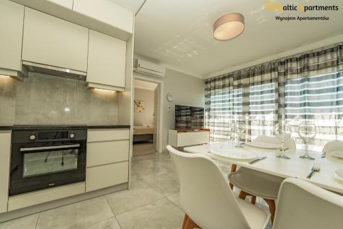 Kuchyň nebo kuchyňský kout v ubytování Baltic Apartments - Apartamenty Bałtyk Bay View