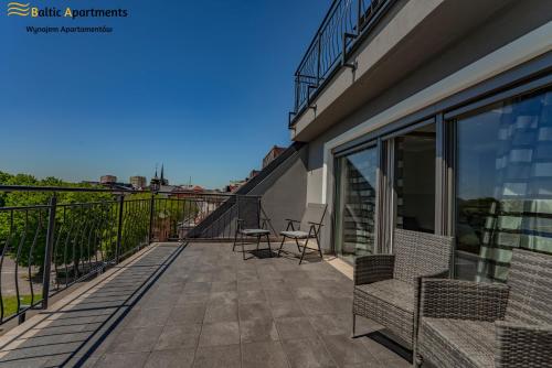 Balkón nebo terasa v ubytování Baltic Apartments - Apartamenty Bałtyk Bay View