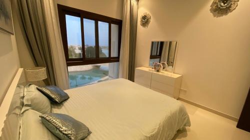 A bed or beds in a room at WASAN LUXURY RESIDENCE HAWANA Salalah