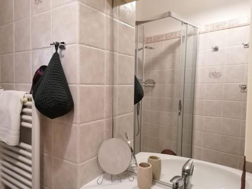 a bathroom with a shower and a sink with a mirror at PERLA DEL GOLFO (con Box Auto) in Lerici