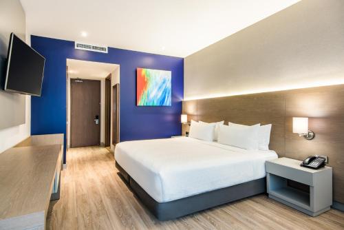 Postel nebo postele na pokoji v ubytování Holiday Inn Express Bogotá - Parque La 93 by IHG