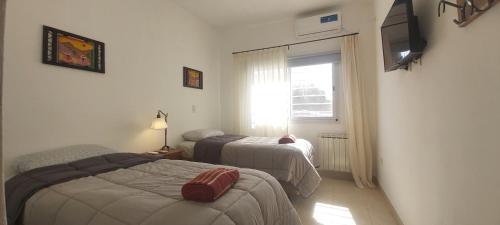 Posteľ alebo postele v izbe v ubytovaní Renda Iporava, Hermoso departamento en Salta
