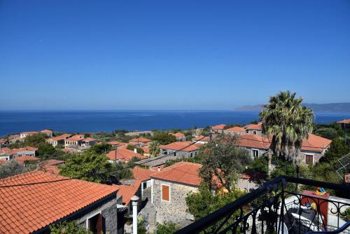a view of a town with red roofs at Maria & Kiki 2 Studios in Mithymna