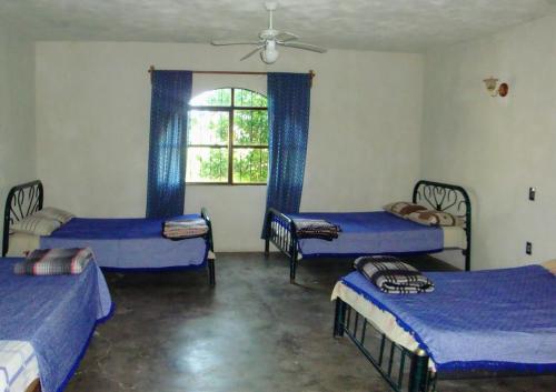 Katil atau katil-katil dalam bilik di Casa De Descanso Cuautla Morelos