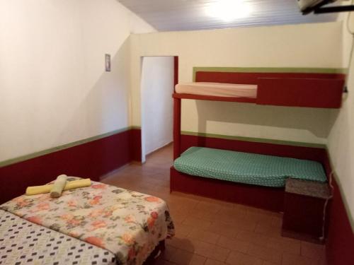 Postel nebo postele na pokoji v ubytování Pousada Enseada do Coqueiro